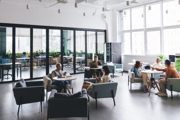 Group of coworkers in spacious workplace